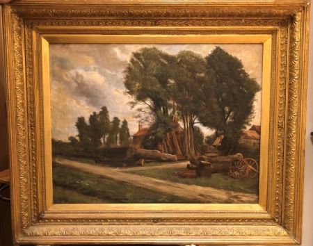 Landscape scene showing brick buildings, tall trees and stacks of cut timber